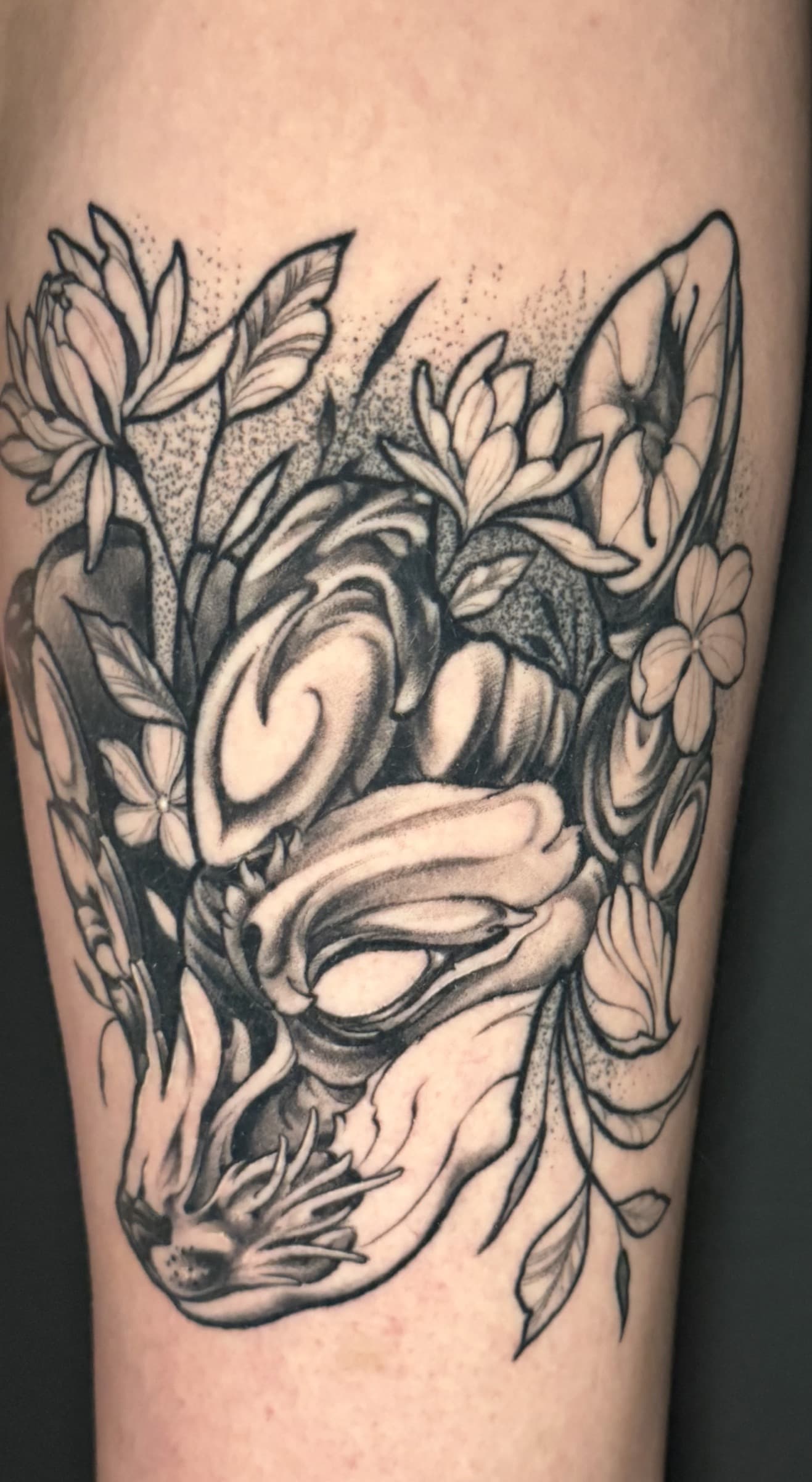 Healed blackwork rose tattoo by Pete Seyring.